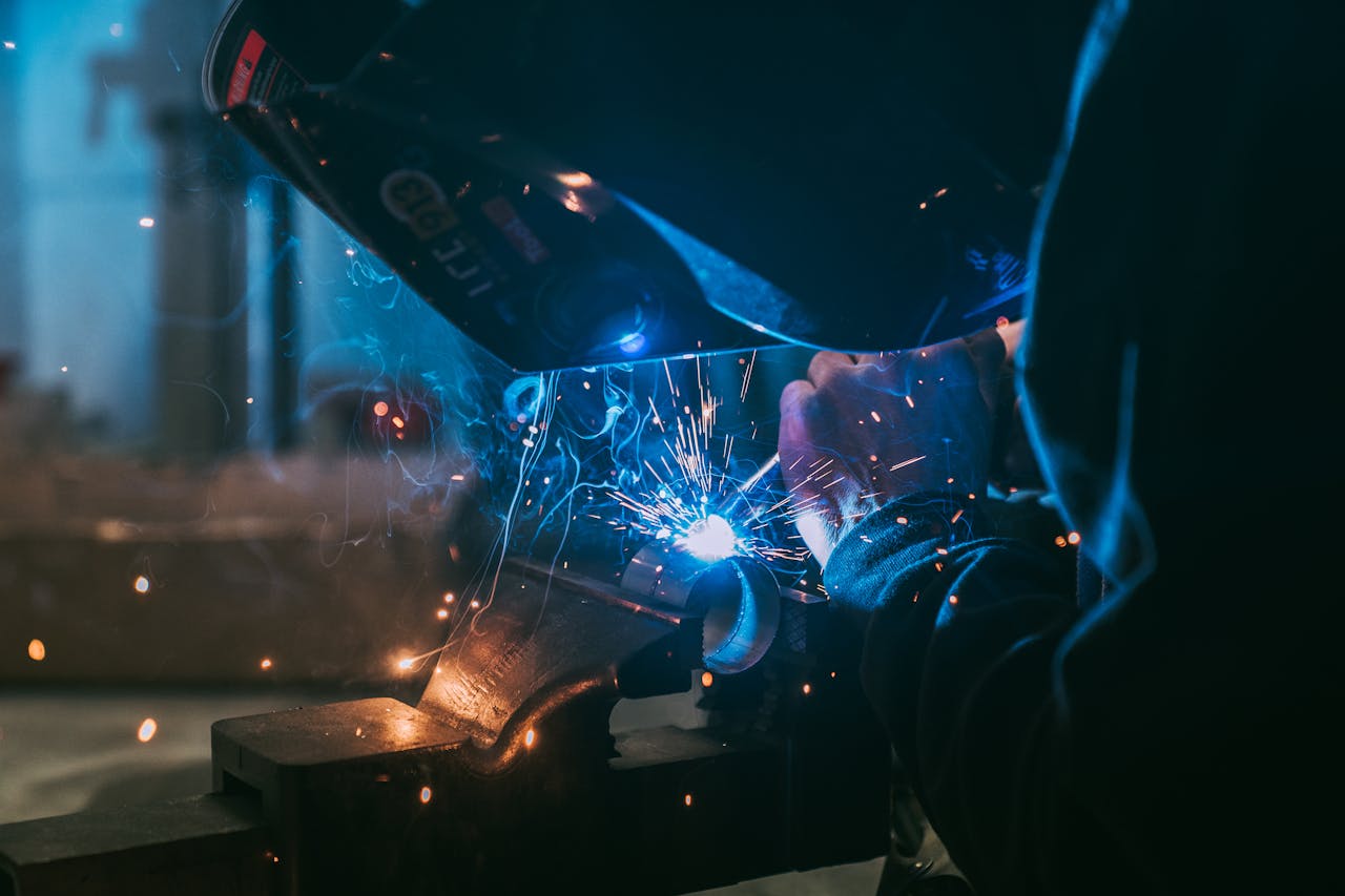 The Art of Drawing Readers In: Your attractive post title goes here Close-up of a welder working with sparks flying, showcasing industrial craft in Paris.